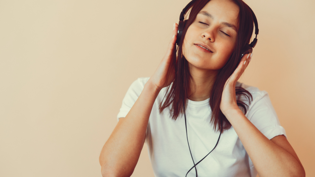 a person listening to music with headphones