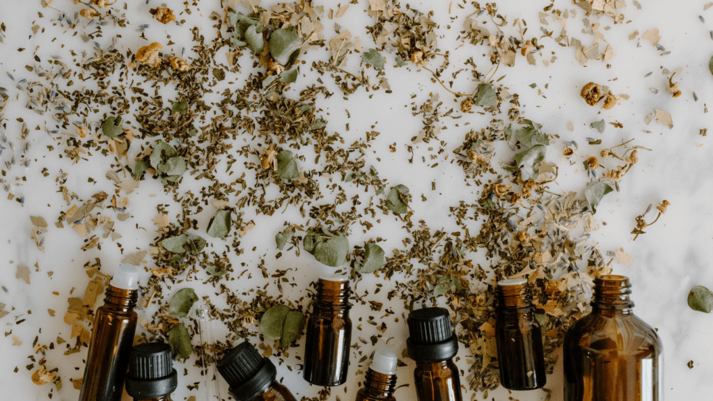 several bottles of essential oils and herb