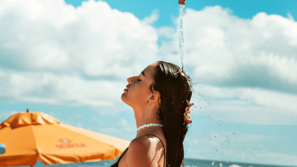 a person is taking a shower and smiling