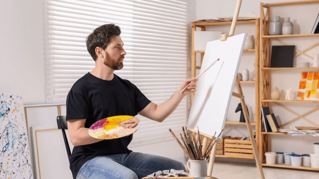 a person sitting on an easel in an art studio