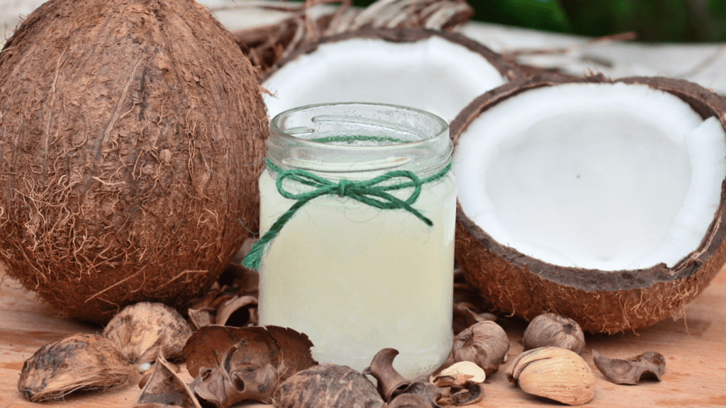 coconut oil and coconut shells on a cutting board