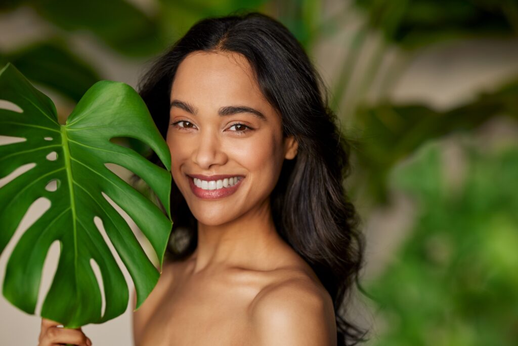 beauty natural woman with monstera leaf looking at 2025 01 07 22 12 34 utc